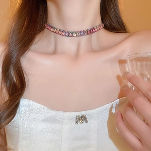 Close-up of model wearing a colorful gradient rhinestone choker necklace set