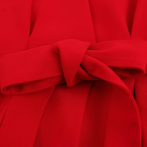 Women's V-neck sleeveless top in red with a stylish waist tie detail and bow accent