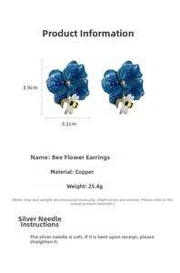 Detailed view of bee and blue flower earrings with 3.9cm by 3.1cm size measurements