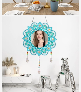 Detail of DIY mandala diamond painting mirror with blue floral patterns and bead charms
