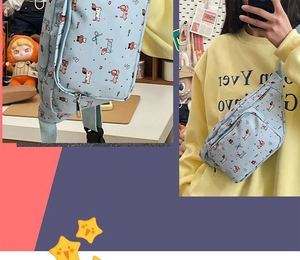 Detail of light blue crossbody bag with cartoon dog print and adjustable strap