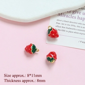 Detailed close-up of 8x11mm strawberry charms with red enamel and gold plating for DIY jewelry