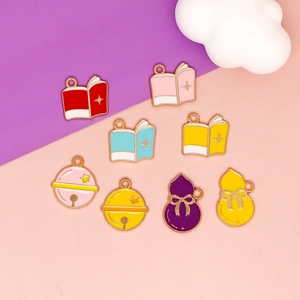 Assorted DIY enamel alloy charms including books, bells and gourds with gold plating