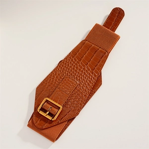 Detail of brown crocodile pattern wide waist belt with golden square buckle and elastic band