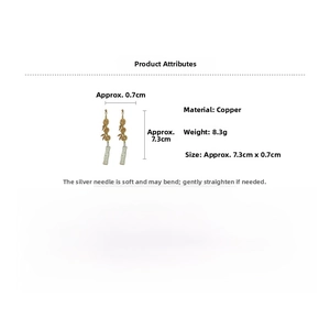 Detail view of tassel earrings with dimensions 7.3cm by 0.7cm and weight of 8.3g
