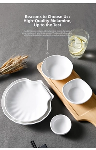 White melamine shell-shaped plates and small bowls on a wooden tray for dining