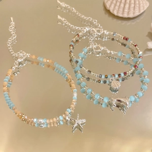 Kristallperlen-Armbänder im Ozean-Design mit Seestern-, Delphin- und Muschelanhängern