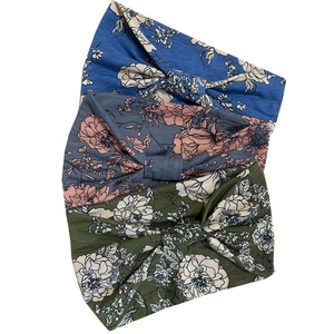 Three-piece yoga headband set featuring floral prints in blue, grey-purple, and dark green