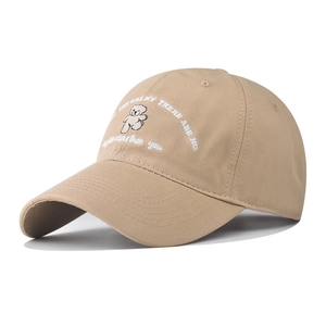 Close-up of the khaki cotton baseball cap featuring detailed bear embroidery and fine stitching