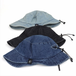 Denim bucket hats in blue and black with adjustable windproof drawstring and wide brim