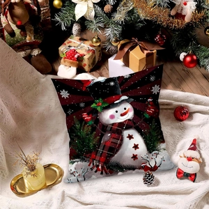 Plush Christmas snowman pillow cover with festive decorations on white knit blanket