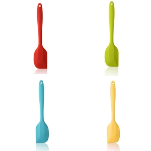 Set of 4 colorful small silicone spatulas in red, lime, blue and yellow for baking