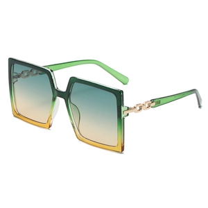 Modern oversized square sunglasses with green translucent frames and gradient lenses