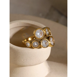 Macro shot of gold-plated zircon ring with double-layered interlocking crystals