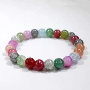 Macro shot of colorful beaded natural stone bracelet featuring unique ice crack textures