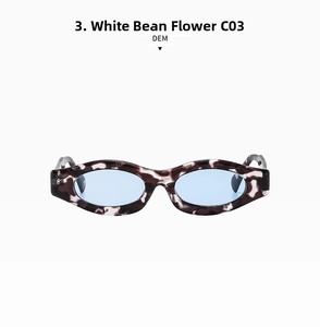 Detail view of white tortoise narrow sunglasses frame with translucent blue lenses