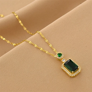 Luxurious gold necklace with rectangle green gemstone pendant and crystal halo detail