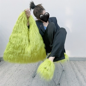 Detail of neon green faux fur tote bag and matching shoes in a Y2K plush texture style