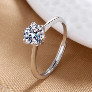 Macro side view of elegant six-prong silver engagement ring with sparkling crystal stone