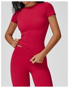 Detail of slim fit quick-dry yoga top in deep red with high-elastic athletic fabric