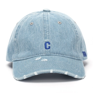 Detail of distressed denim baseball cap featuring blue C embroidery and 1989 lettering
