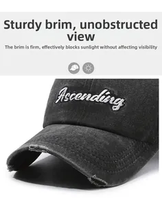 Detail of embroidered Ascending letters on distressed washed baseball cap brim