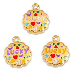Close-up of golden enamel Lucky charms with colorful heart and moon patterns