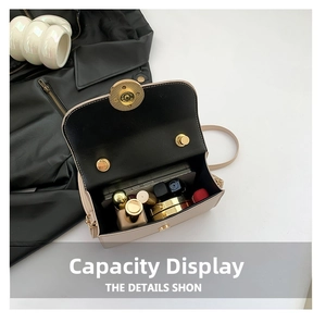 Detail view of beige crossbody bag interior showing phone and lipstick storage capacity
