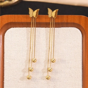 Elegant gold butterfly tassel earrings with matte finish and dangling chain beads
