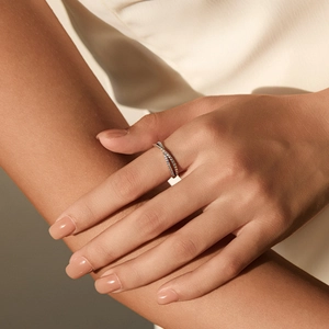 Elegant S925 sterling silver twisted crisscross ring with cubic zirconia stones on model