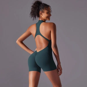 Macro shot of dark green yoga jumpsuit with open back design and scrunch butt detail