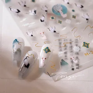 Macro detail of Chinese style nail stickers featuring cranes and golden auspicious clouds