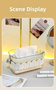 Detail of light luxury tissue box with wavy pattern and silver metal handles for home decor