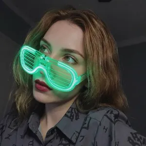 Detail of green LED shutter glasses glowing in the dark for party and club festivals
