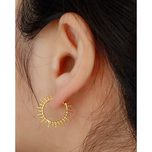 Minimalist S925 sterling silver golden sunburst hoop earrings for women on ear
