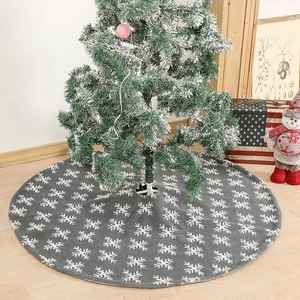 Grey plush Christmas tree skirt with white snowflake patterns for festive holiday decoration