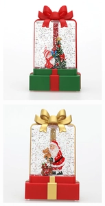Close-up of gift box style Christmas water lanterns with Santa Claus and glitter
