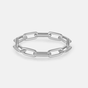 Detail view of the silver cuban link chain ring featuring a modern minimalist metallic texture