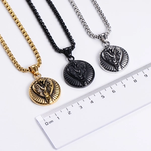 Three oval stainless steel snake pendants in gold, black, and silver with a measuring ruler