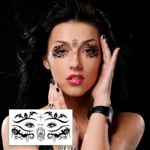 Detail of gothic spider and bat face tattoos stickers for Halloween eye makeup look