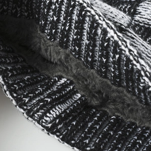 Knit beanie with thick black fleece lining and grey marl woven exterior for winter warmth