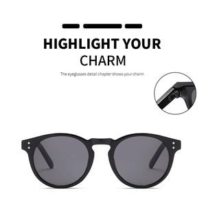 Detail of metal hinge construction and vintage rivets on black retro sunglasses