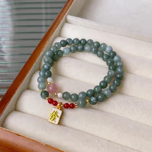 Double-layer beaded bracelet with green jade beads and golden lucky tag pendant
