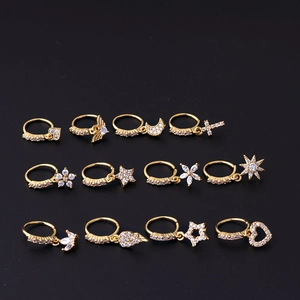 Set of 12 gold plated nose rings with zircon charms like moon, star, and heart shapes