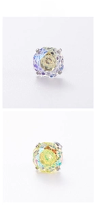 Macro detail of octagon-cut zircon earrings with vibrant rainbow AB coating and 4-prong setting