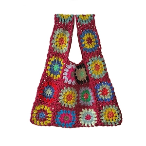 Handmade colorful crochet tote bag with vivid granny square patterns and cotton yarn texture