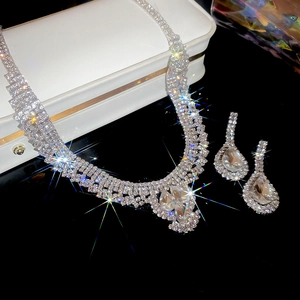 Detailed view of silver crystal waterdrop necklace and matching earrings jewelry set
