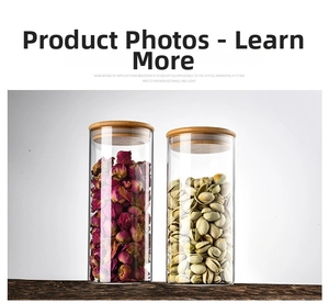 Detail of two glass food storage jars with wooden lids for tea and pistachios