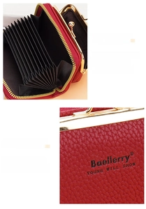 Detail of red litchi leather wallet with multiple card slots and gold kiss-lock closure