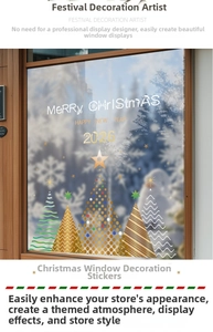 Detailed close-up of golden Christmas tree stickers and festive snow decals on a glass window